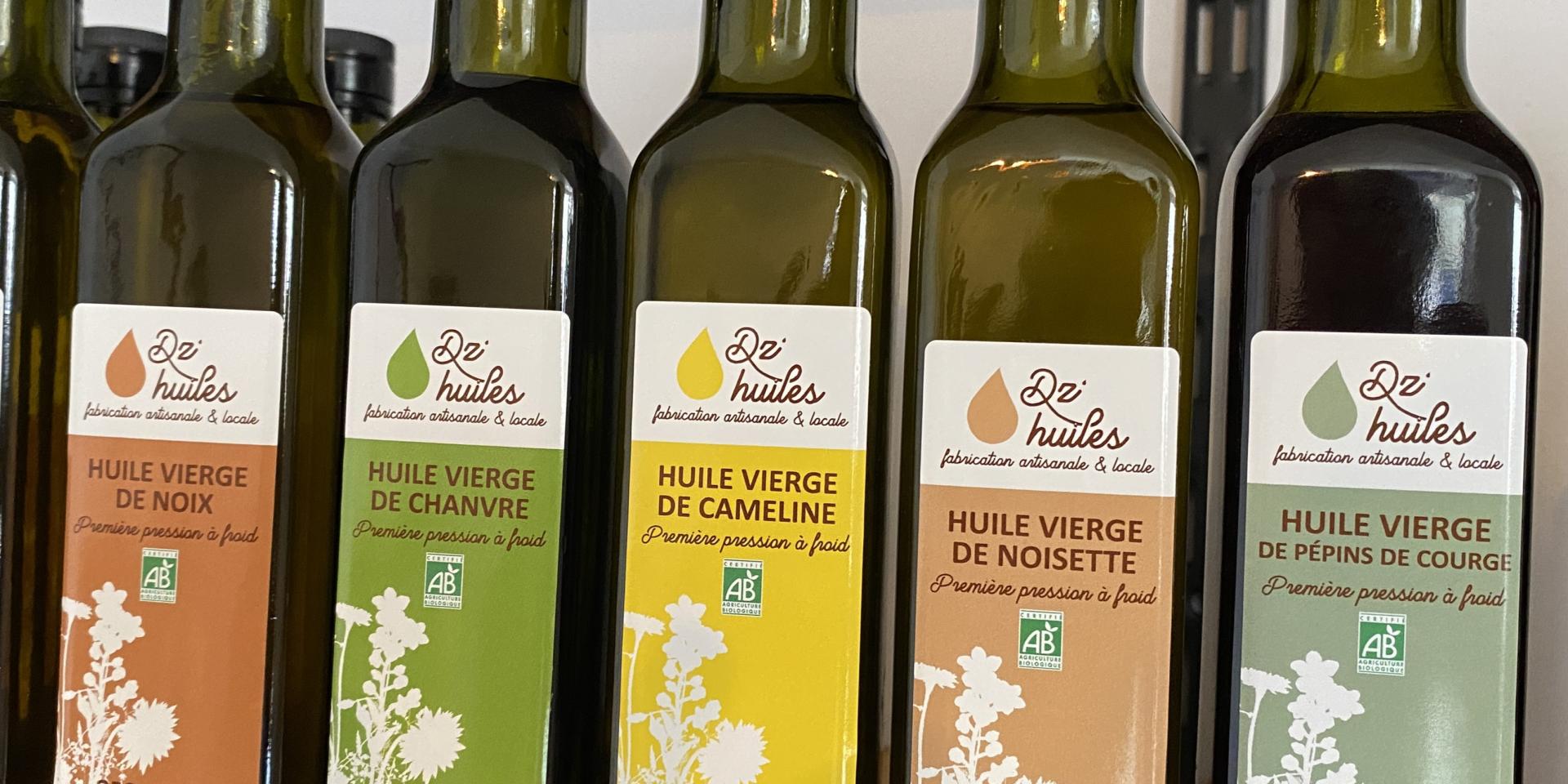 Dz huiles - Bouteilles d'huiles sur une étagère